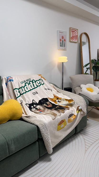 Blanket with dog illustrations draped over a sofa in a living room setting.